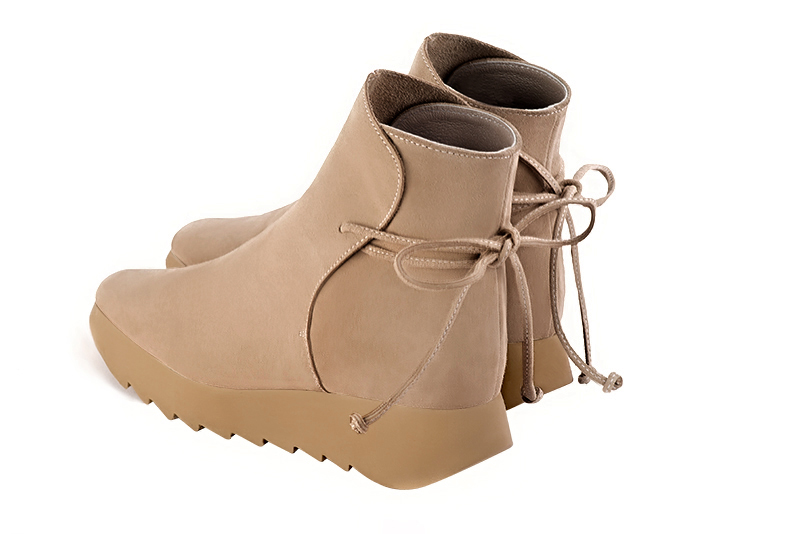 Tan beige women's ankle boots with laces at the back. Square toe. Low rubber soles. Rear view - Florence KOOIJMAN